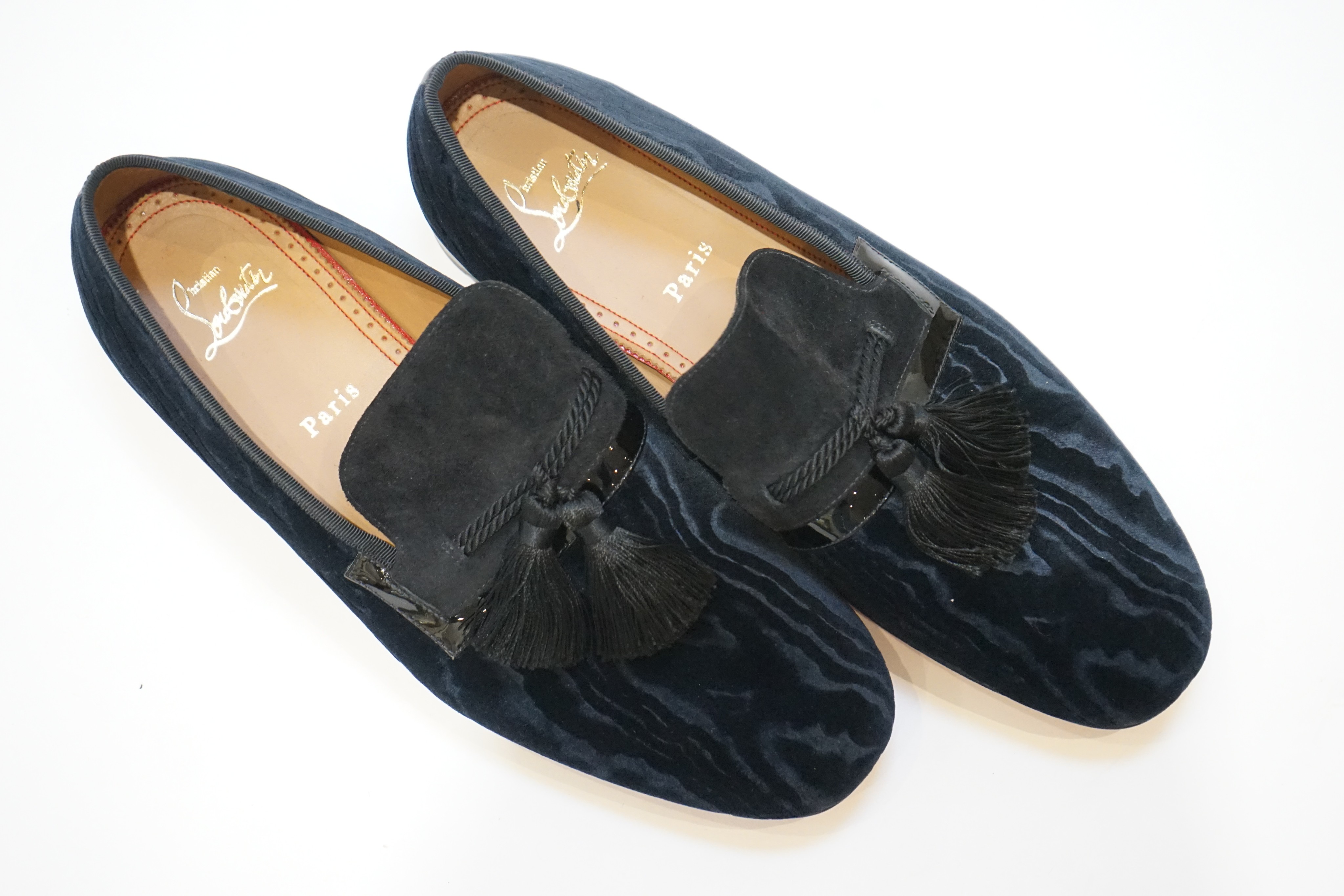 A pair of gentleman's Christian Louboutin navy blue watered velvet and suede evening slippers with black tassels (unworn), size 42.5, in bag